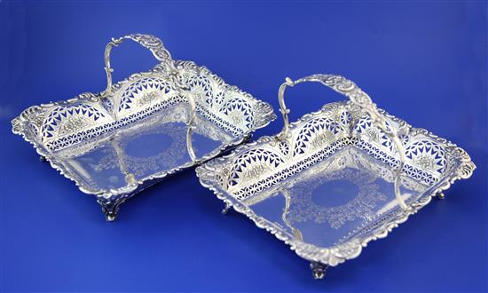 An ornate pair of late Victorian silver fruit baskets. 39 oz.